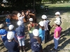 Campers learning about how to saddle a horse